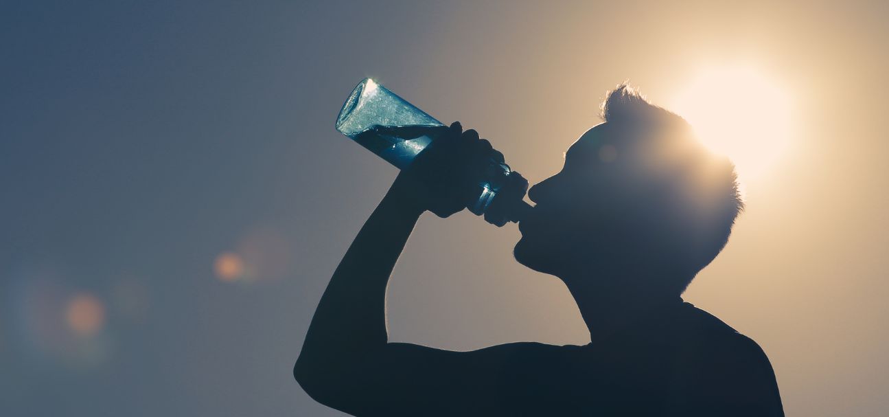 man drinking water