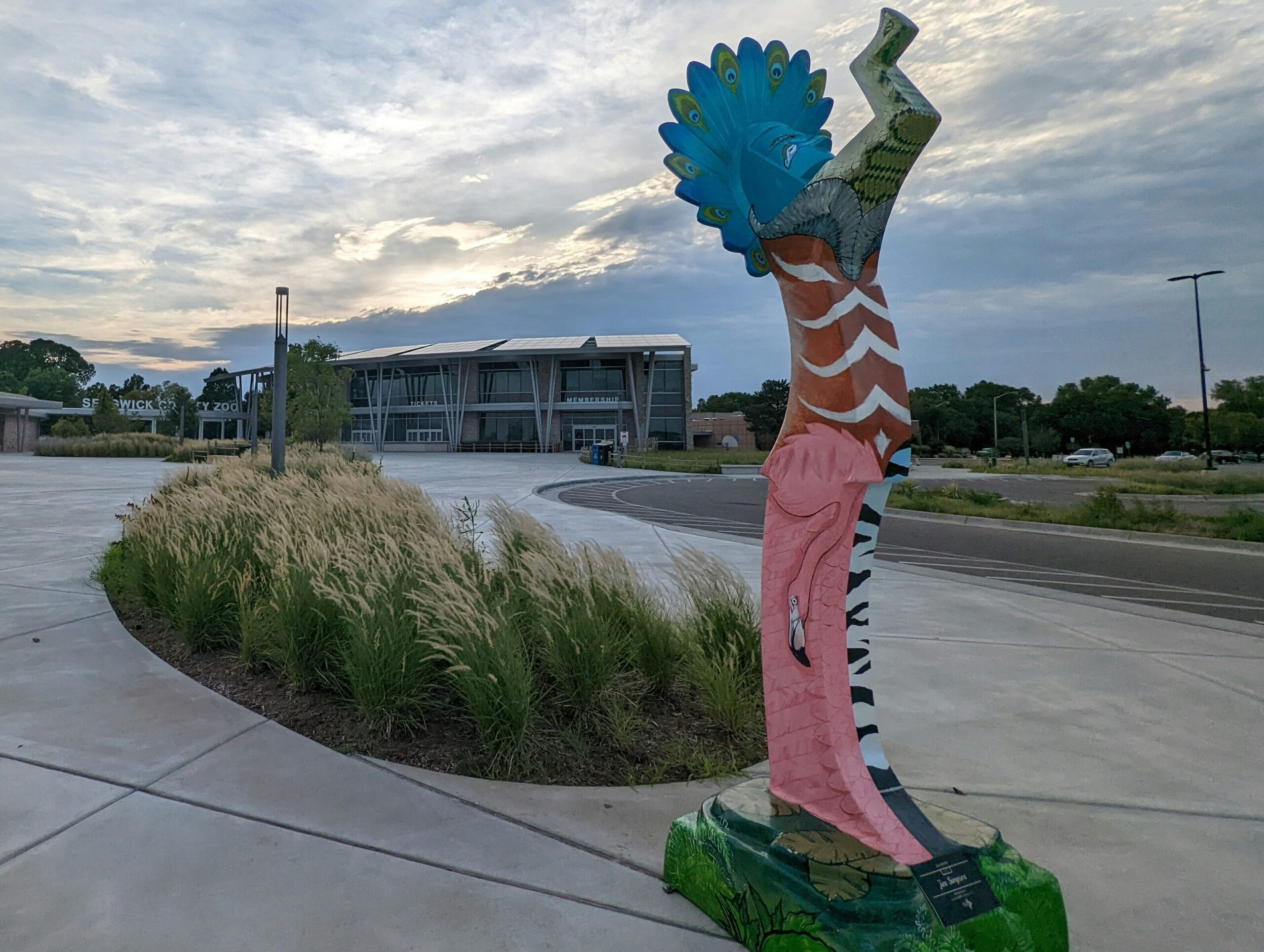 Colorful Keeper of the Plains sculpture outside the Sedgwick County Zoo in Wichita, Kansas, symbolizing local community and culture.